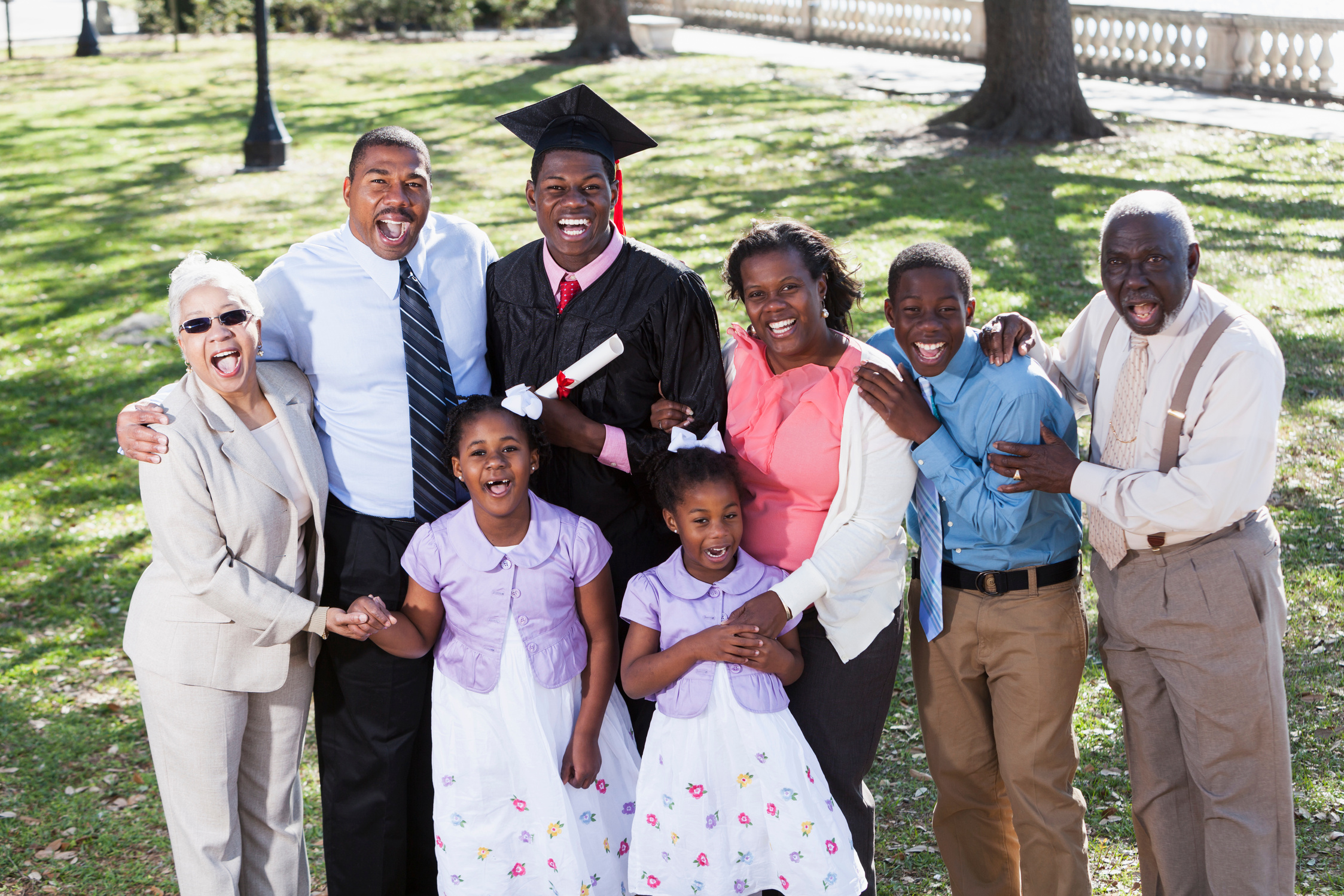 African American graduate with proud family